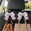 BVGACI 2 Pack Car Purse Hooks, Cute Bow Car Seat Headrest Hook Hanger for Purses and Bags (pink) view 1